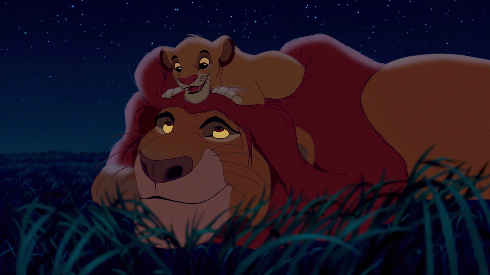 Mufasa lies in the grass at night beneath a field of stars, cub Simba resting against his head, both at ease.